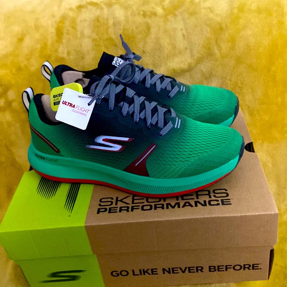 Green and Black Skechers. Women size 9.5